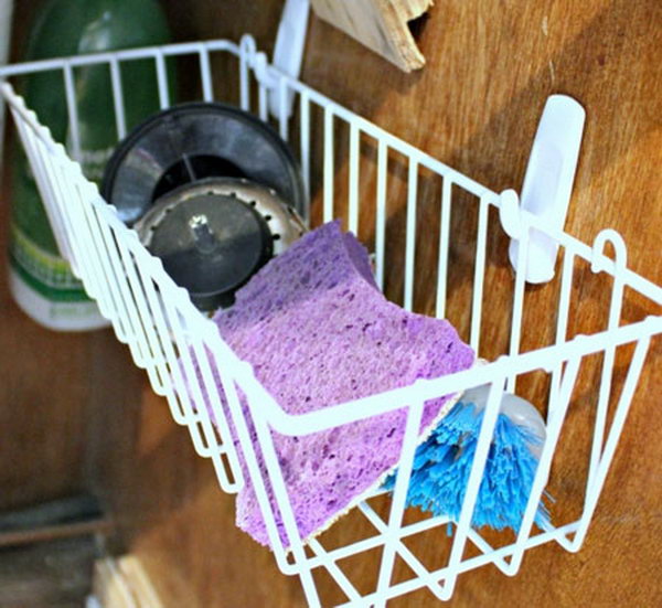 Hang a simple dollar shopping basket on the inside of your closet door. It's a smart idea for storing under the sink for wet sponges and brushes and giving them air to dry. 