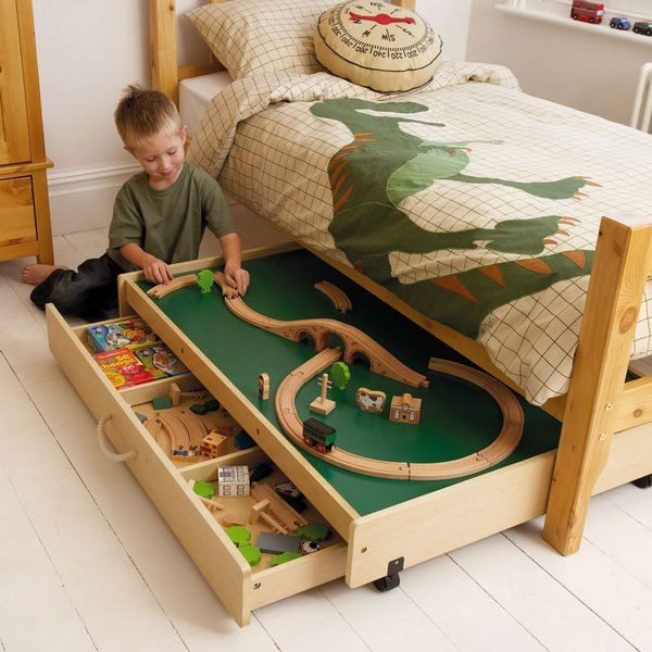 This game table under the bed not only offers a useful play area in your busy bedroom, but also offers more storage space for toys. 