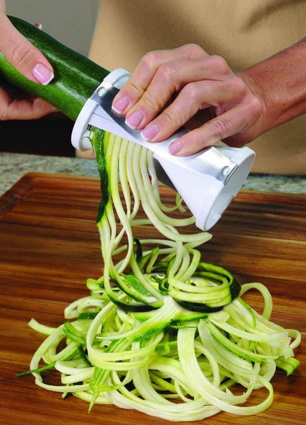 Spiral vegetable slicer. This cool kitchen device cuts your standard vegetables into pasta-like spaghetti shapes and helps you prepare healthy low-carb meals or stunning salads.  