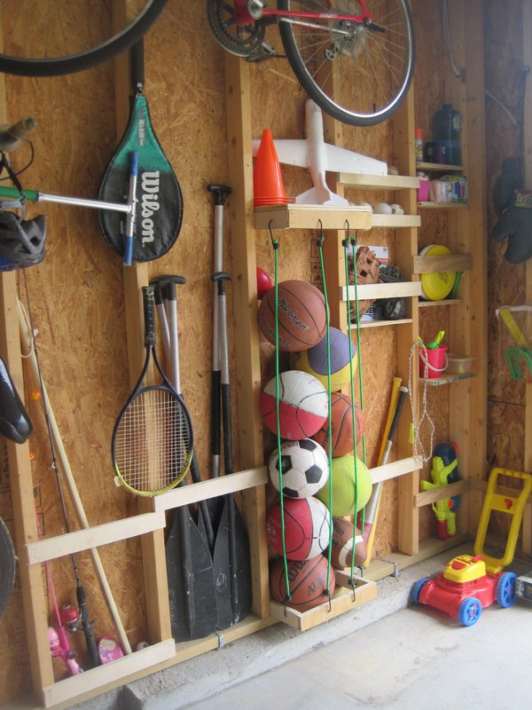 Storage between the bolts. Use the space between the tunnels to organize things. With a few bungee cords hanging on rivets, you can store all kinds of sports equipment. 