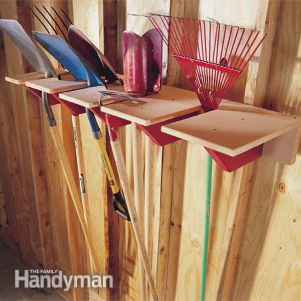 DIY wooden scoop shelf. A simple yet functional garage storage idea for garden tools. Keep them off the floor with this DIY rack. 