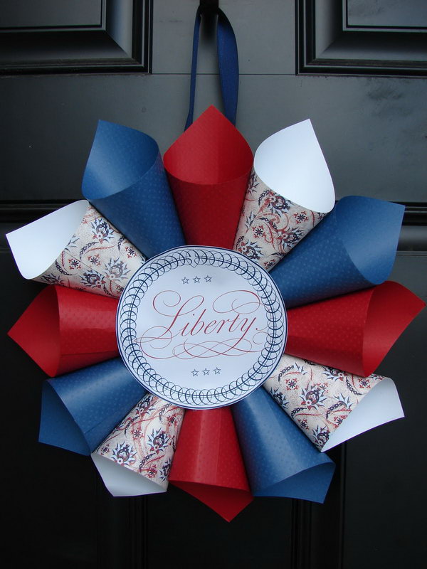 Patriotic paper cone wreath. DIY July 4th wreath of colored red, white and blue patterned papers. 
