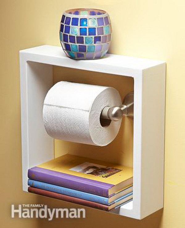 Take a picture frame with a deep shadow box and hang it around your toilet paper holder. It gives you two practical shelves for small items in small bathrooms. 