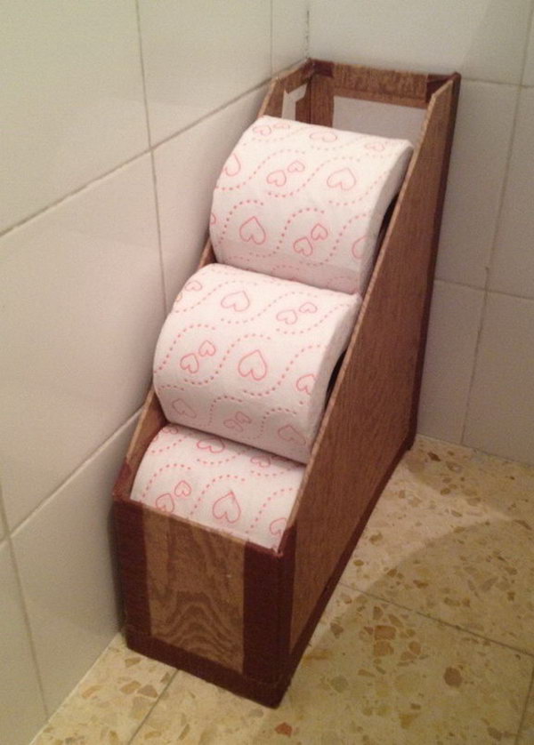 Use a newspaper rack again to hold toilet paper rolls. 