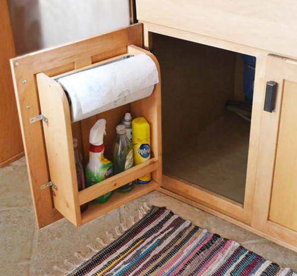 Attach brackets to the inside of the cabinet door to store toilet paper rolls, cleaning supplies, tools, or other items in the lower cabinet.  