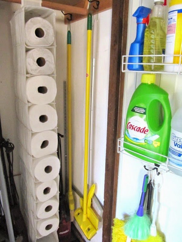 Use a hanging shoe organizer to hold the unused paper towels. 