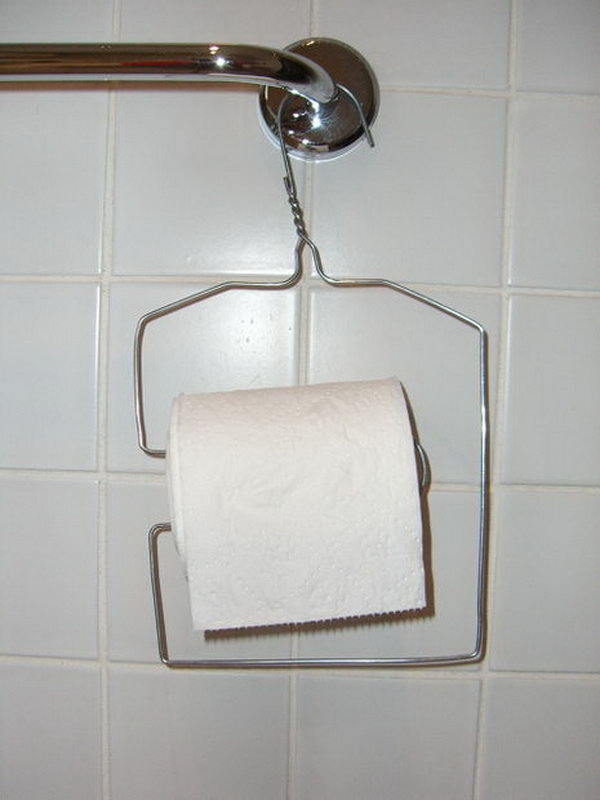 This wire hanger has been upcycled into a toilet paper holder. 