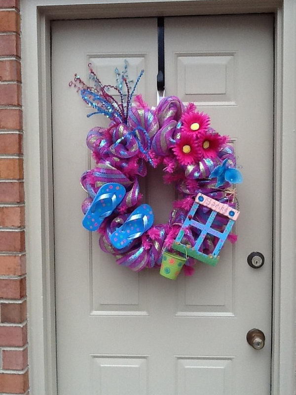 DIY flip flop wreath decoration. Add a touch of color to your home with a creative flip-flop wreath on your door when summer comes.