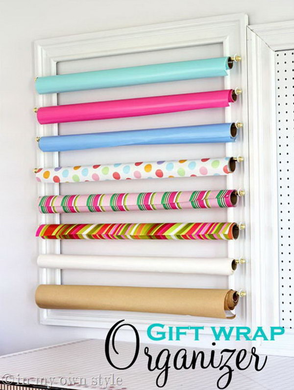 Make a gift wrap organizer with a frame and curtain poles. It looks like a piece of art hanging on the wall. 