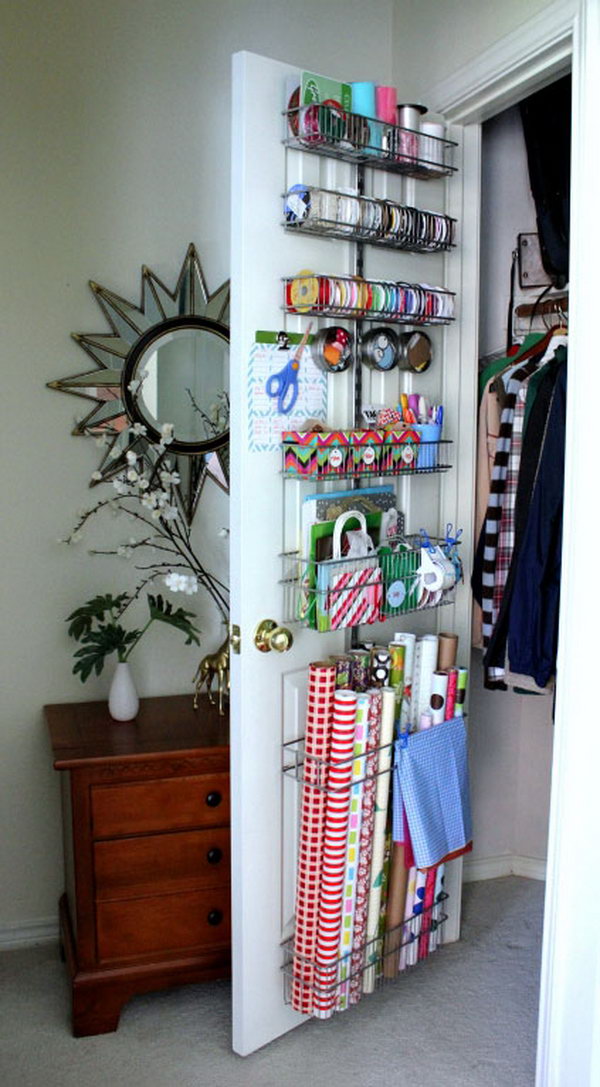 Keep wrapping paper behind the cabinet door so that you can easily access it but not in the way.  