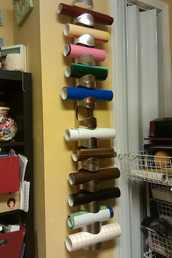 Store vinyl or wrapping paper with IKEA wine racks. It cost less than $ 25 and it took 20 minutes to put it on the wall. 