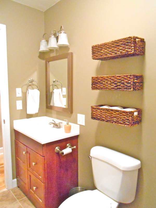 Use the baskets over the toilet to store plasters, extra toilet paper, and other first aid items. These baskets are not only beautiful, but also functional. 