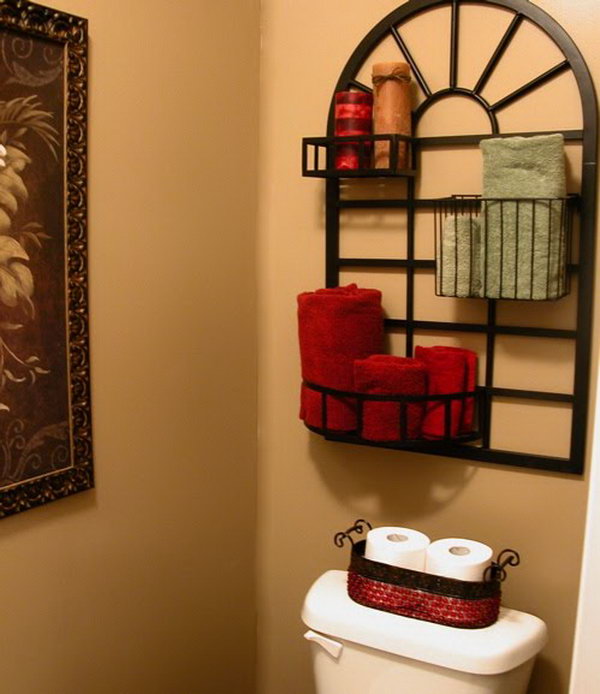 What a great idea with this pot stand over the toilet for storage and presentation. 