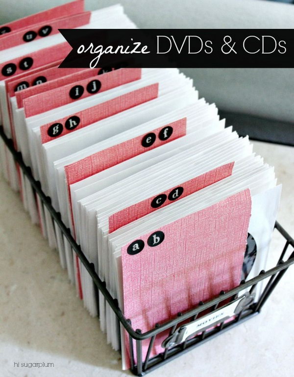 Reduce storage space using the CD and DVD cases. Make alphabet dividers out of sturdy scrapbook paper and stickers. It makes finding a movie easier. 