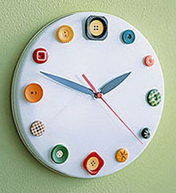 Button watch made of biscuit tin lid, buttons and watch parts. It is a great idea to help children read time. 