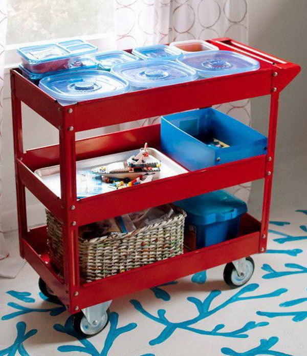 Use a steel service cart with three shelves to store the Lego sets and characters, as well as ongoing projects. Children can work at the dining table, the kitchen table and the coffee table - wherever the family gathers. 