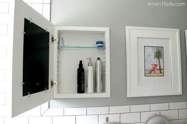 Hide bathroom cabinets behind wall art. They offer more than enough hidden storage space. 