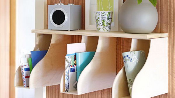 If you put a couple of magazine racks under a shelf, you can make room for mail and accessories. 