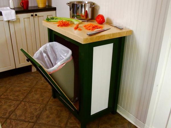 Hide your trash can in style with this hinged door cabinet and add a countertop to create extra space in a small corner. 