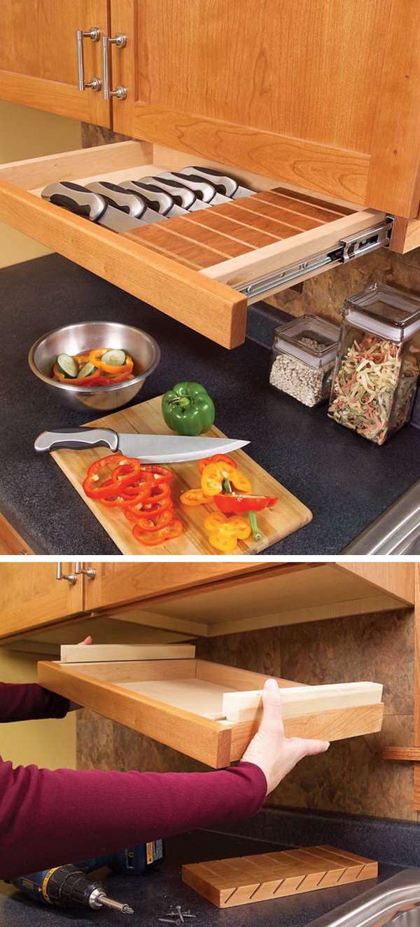 This pull-out drawer under the kitchen cabinet is perfect for storing knives. 