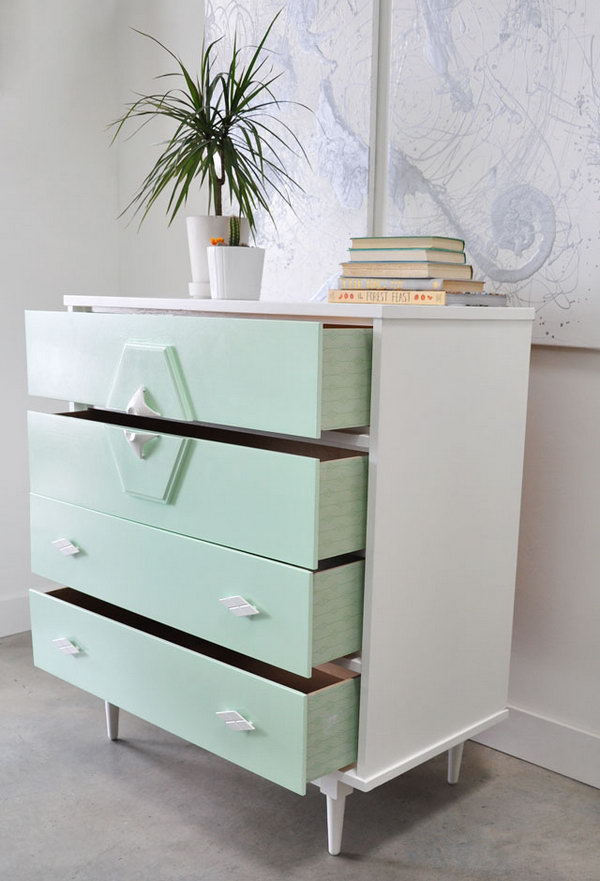 Use spray painting to turn a vintage chest of drawers into a modern piece of furniture. 