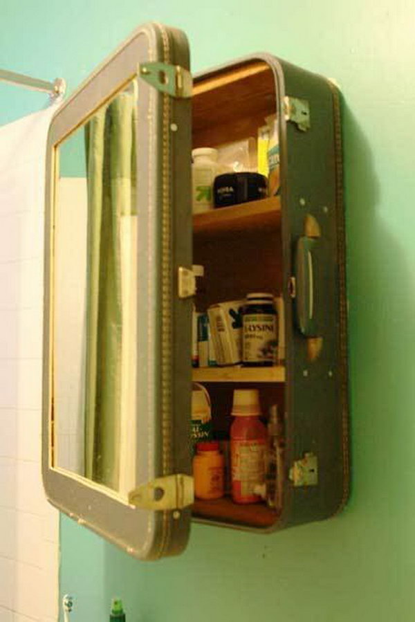 Upcycling an old suitcase into a medicine cabinet. Blake cut the front out of the case and put a mirror in it. Then he created shelves and reinforced the inside with salvaged wood.
