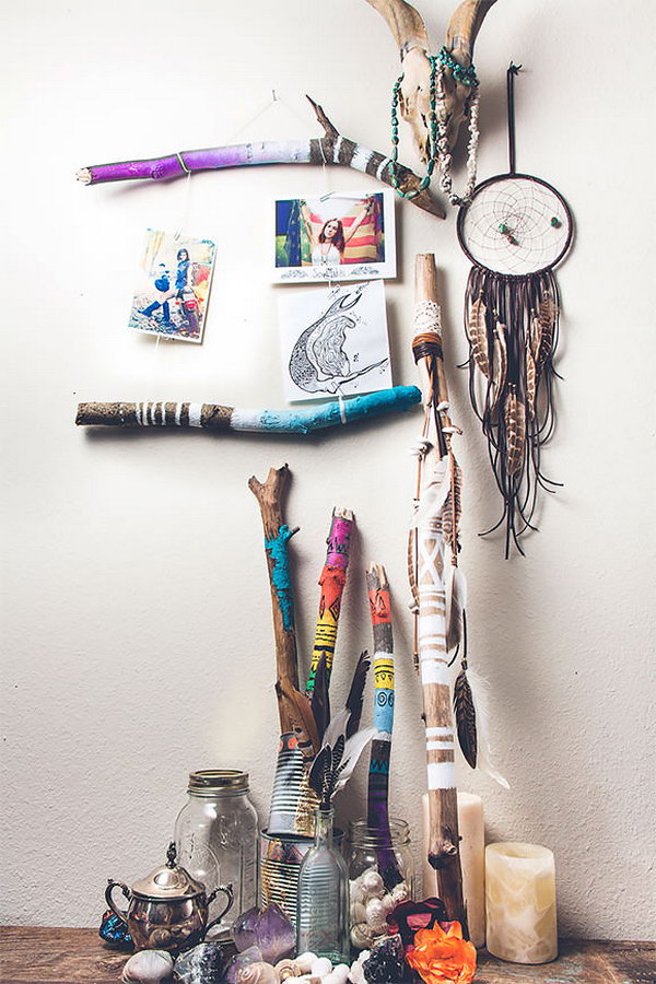 Make a small frame with painted branches. Knot the string and attach the photos to the wall with paper clips (or clothespins). You can do so many things with these painted beauties. 