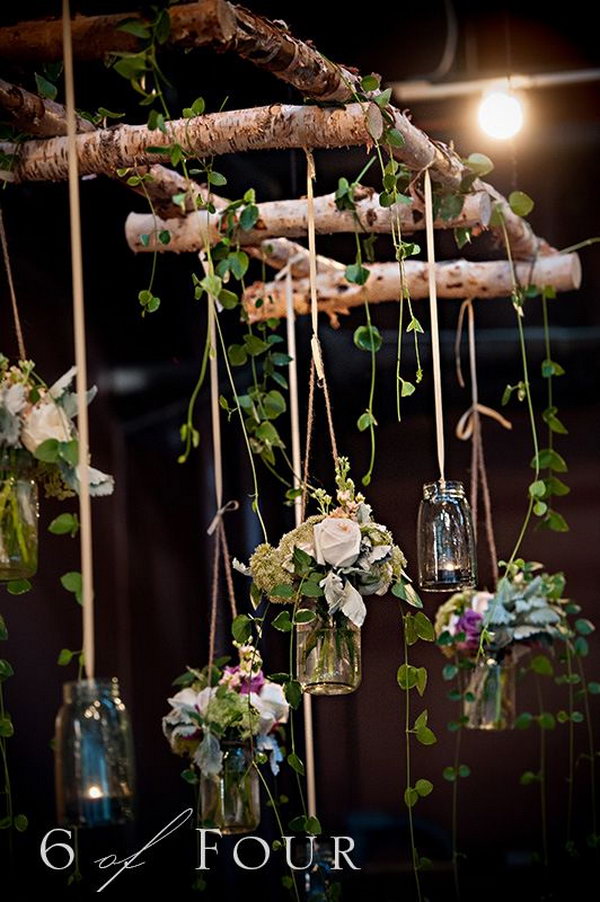 Natural elements, mason jars and the branch ladder make these wedding settings more than visually appealing. 