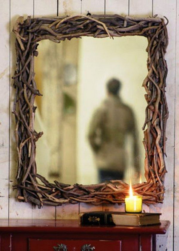 What an effective and stylish mirror frame made of branches. 