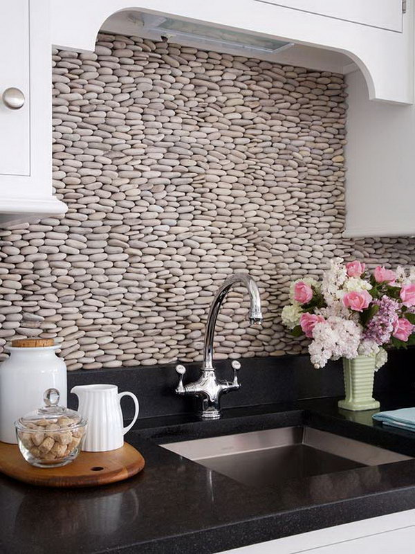 Stacked pebbles for backsplash. Do not only protect the walls from stains, but also give your kitchen design a decorative touch.