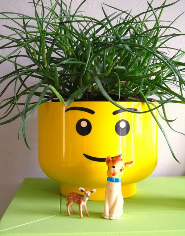 Lego head Flowr pot. These container gardening ideas are a great way to brighten up your surroundings instantly. Make your home unique and interesting in a different way.
