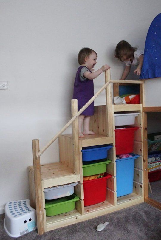 Stair toy storage. The space under a staircase can be used to clear everyday clutter.