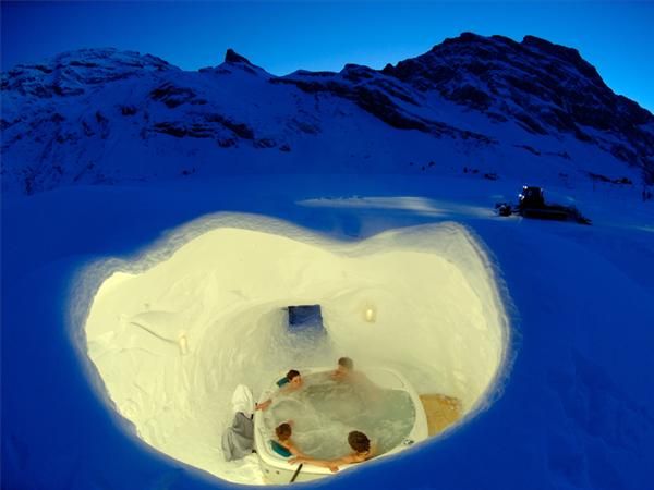 Igloo Village Hotel in Switzerland. Built from scratch every winter, almost 3000 tons of snow are needed to make every igloo. The standard village consists of an igloo hotel, an igloo bar, a series of tunnels and smaller igloos that serve as private rooms.