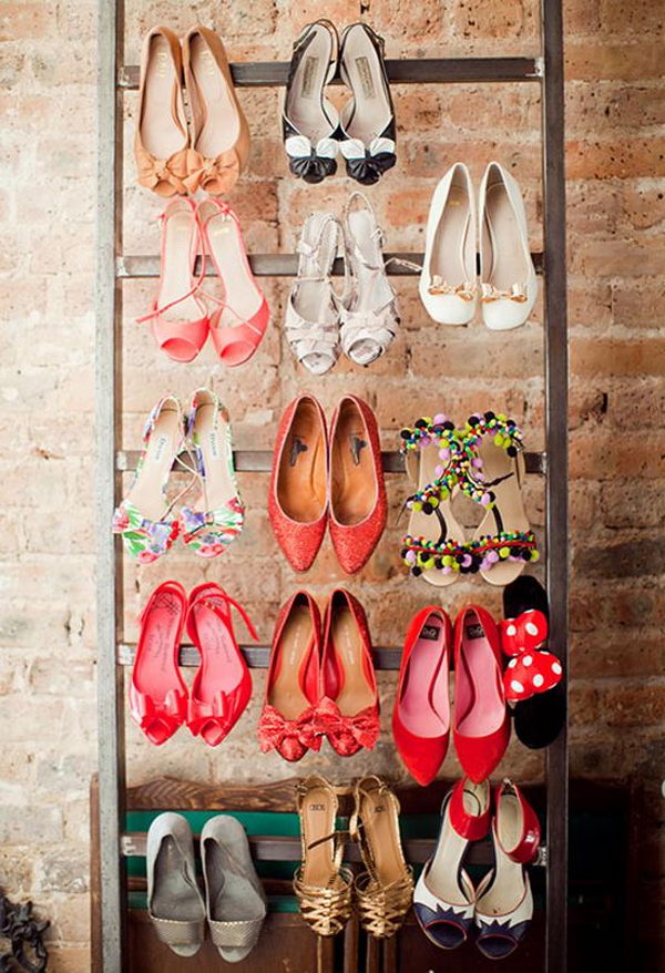 High-heeled shoes were organized and displayed on the ladder.