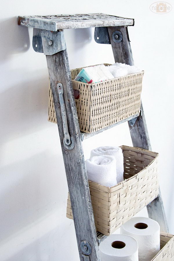 DIY basket ladder storage: use the vertical space and add baskets on top of the old ladder.