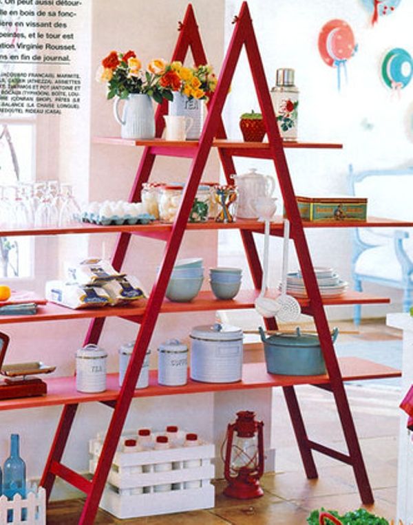 It is a creative decoration idea to have a red ladder shelf in your room.