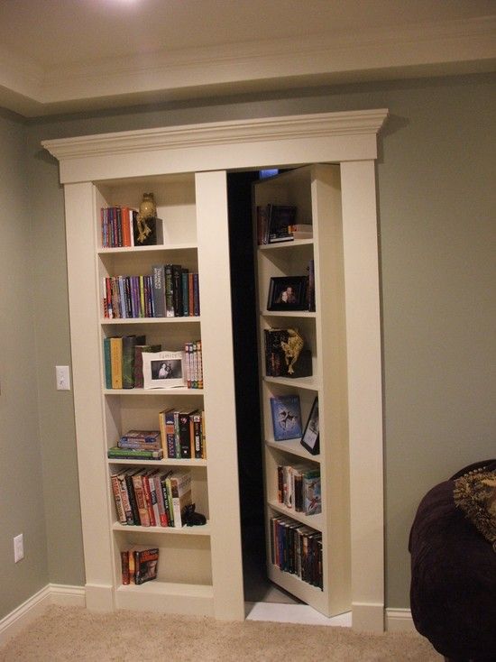 Secret bookcase door. Funny and mysterious idea for the basement, with the bookcase / hidden door for additional storage space for kids' stuff.