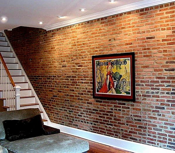 Brick basement wall. If the basement walls were originally made of brick instead of poured concrete, leave them unchanged for a chic, loft-like look. Concrete walls could be treated with artificial stone.