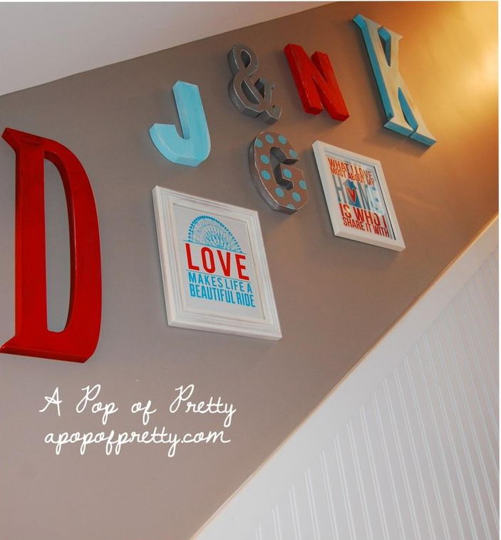 Large monogram letters on the wall. Large monogram letters were hand painted and hung on the walls to represent the members of our family.
