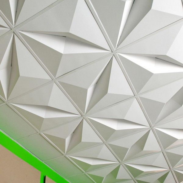 3D ceiling tiles. The lightweight two-by-two foot modules are made from recycled cardboard and are designed to be shipped flat and folded at the installation site. They are a cost-effective and dramatic solution for rooms where suspended ceilings are required.