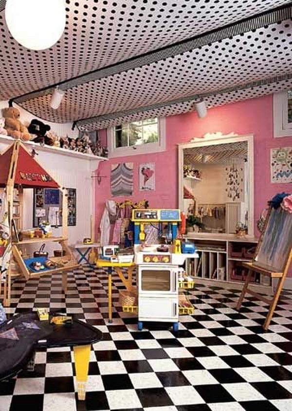 Playroom with a tent cover in the basement, which was created by stapling fabric panels on exposed floor beams.