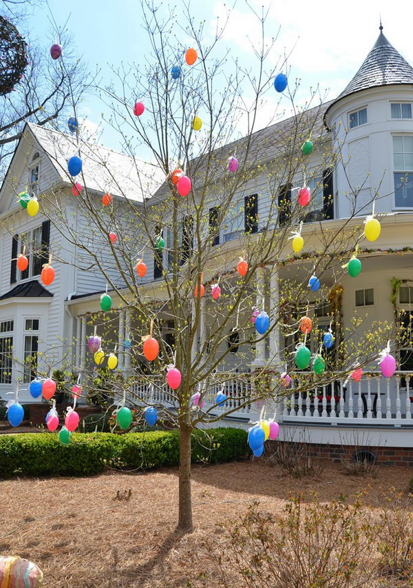 Colorful easter eggs adorned tree. 