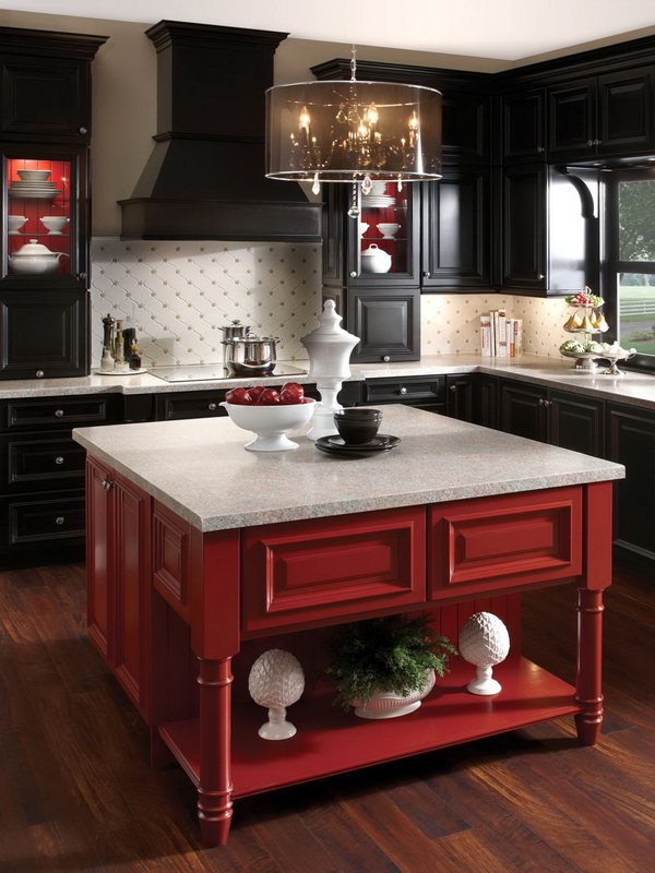     Black with a hint of red. Black cabinets were so hot, but so much black can feel heavy and dark. Buoy it with a dash of brilliant colors, like the red on this kitchen island. 