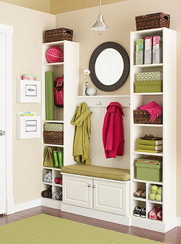 Create this mini mud room from IKEA Billy bookcases and a bit of beadboard and trim. It doesn't cost much and looks like custom fixtures! A super cheap DIY project. Learn more 