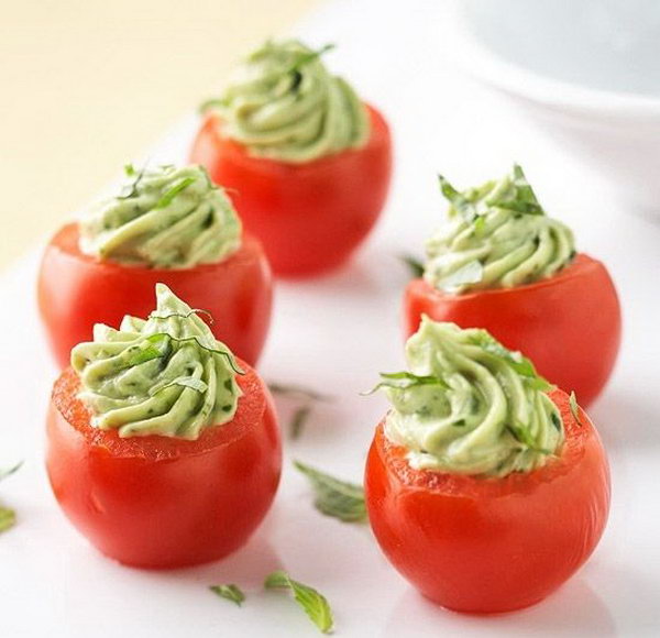Stuffed cherry tomatoes. Stir in the mayonnaise, bacon, spring onions and avocado mixture. Place the avocado mixture in the scooped tomato bowls. Sprinkle some ingredients to give your guests the perfect taste. 
