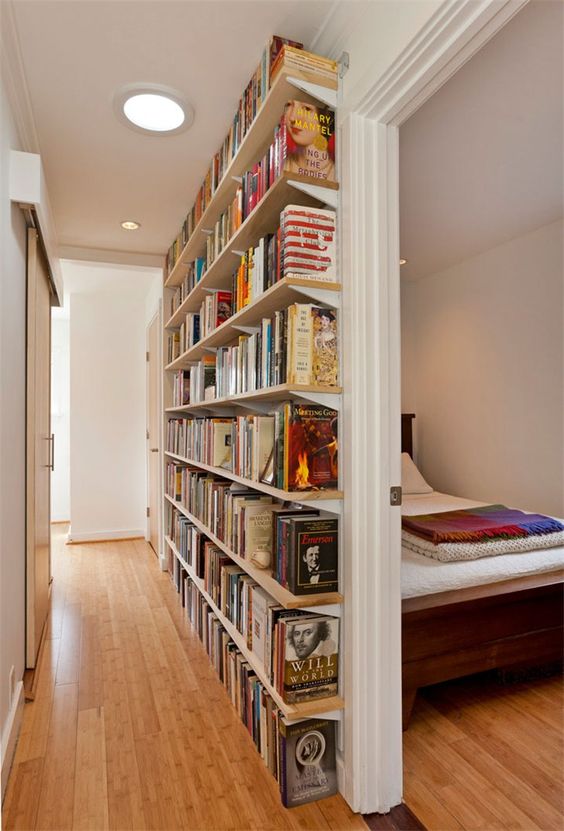 Create a small library in a long, narrow hallway. 