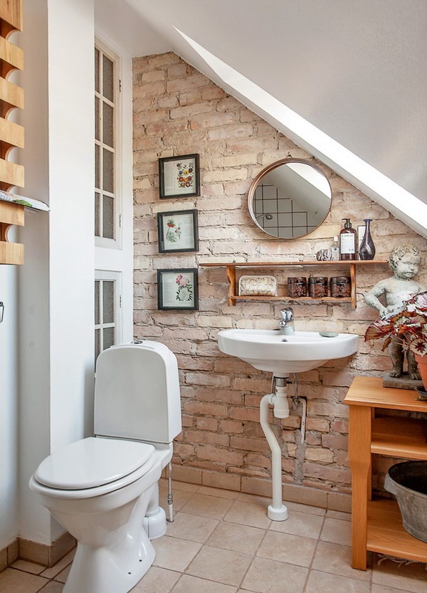 Stylish little bathroom with brick wall 