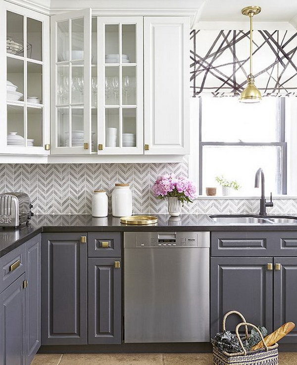 White and gray kitchen cabinets with gold fittings. 