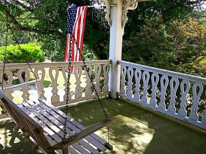 Old house porch swing stock photo 27e73a60-6a24-4a8a-9711 .