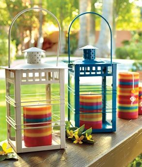 cute way to spruce up lanterns...used colorful candles inside .